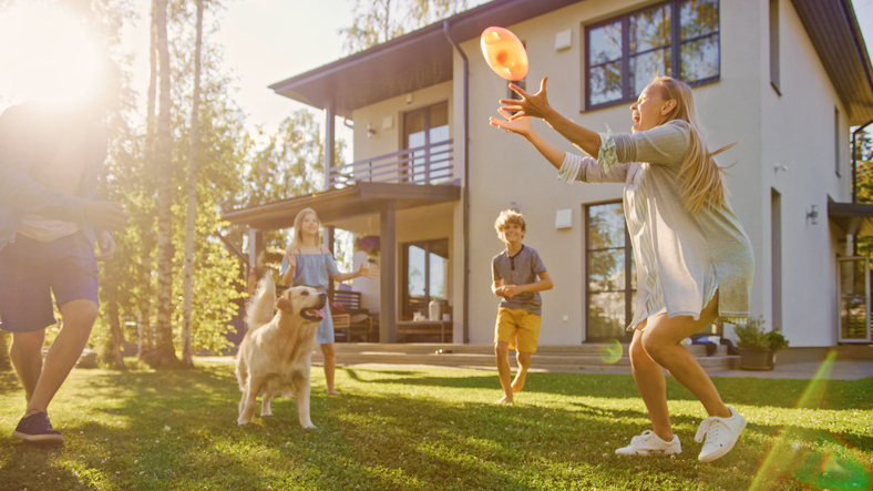 Family playing on lawn